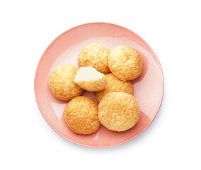 Plate with delicious choux pastry on white background