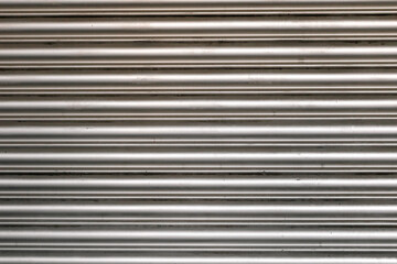 Obraz premium Black embossed background / Realistic metal background / Vector / Garagentor Hintergund / Structure / Texture / Background / Industrie / Roller shutter gate / Metal roller garage door as background