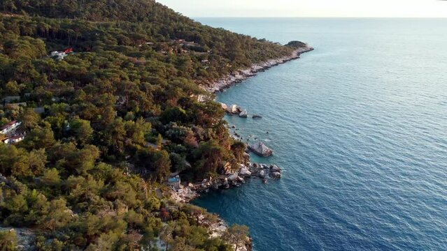 Aerial drone view of the coast of the sea in Faralya, Turkey. Going to Actas beach.