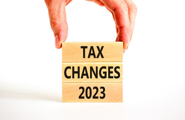 Tax changes 2023 symbol. Concept words Tax changes 2023 on wooden blocks on a beautiful white table...