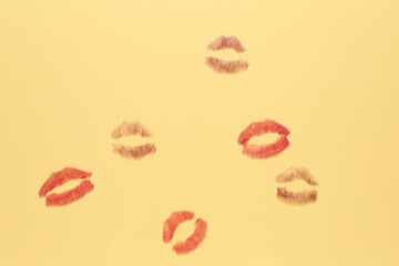 Lipstick kiss marks on beige background