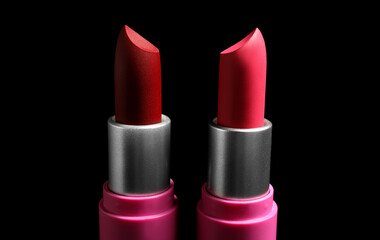Beautiful lipsticks on dark background