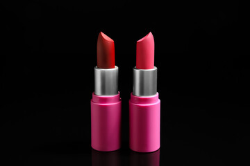 Beautiful lipsticks on dark background