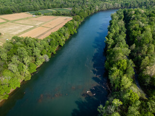 Agricultural fields ready to be planted next to calm Catawba River.