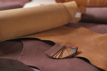 arrangement of premium beige leather, exhibiting the beauty and diversity of natural materials. The Art of Leather. craft of leatherwork and artisan techniques