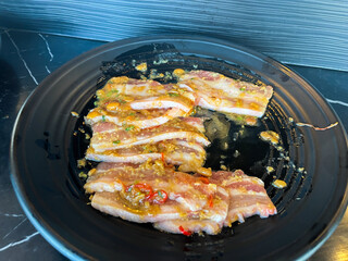 raw beef meat steaks on dish