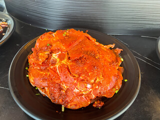 raw beef meat steaks on dish