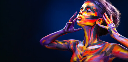 Woman in color body painting on her face. Horizontal banner. Cover art for your mixtape, video,...