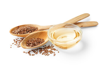 Spoons with flax seeds and bowl of oil on white background