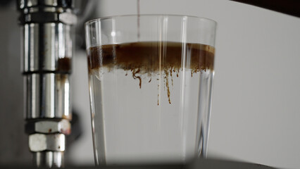 making espresso tonic with coffee machine