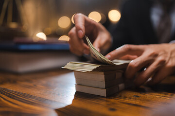 business hands holding dollar bank, Bookkeeper financial inspector checking a money to making calculating balance report, Home finances investment, saving and corruption or insurance economy concept.