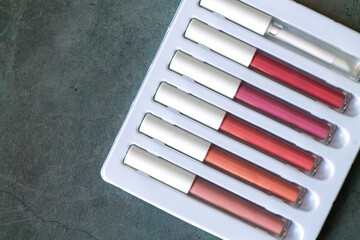 Set of liquid lipstick or lip gloss for makeup - obrazy, fototapety, plakaty