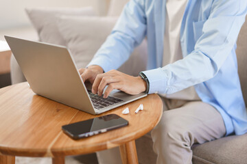 Home office, Businessman typing data on laptop about strategy and planning of new business