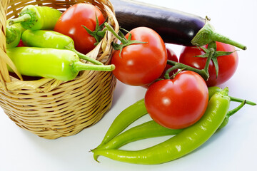 fresh vegetables in basket on white background