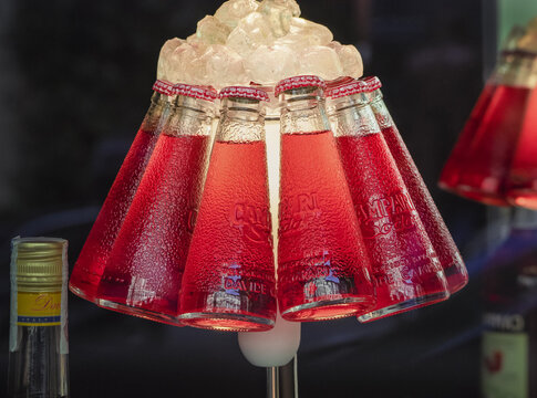 Closeup of Campari Bar table lamp made with small bottles of Campari Soda.Milan - Italy,15th April 2023