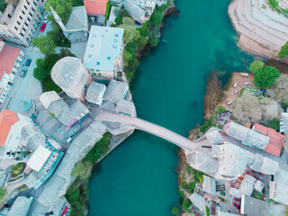 erial Mostar Bridge and Koski Mehmed Pasha Mosque drone view of the historical city of Mostar,...