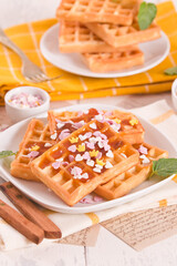 Waffles with jam and confetti. 
