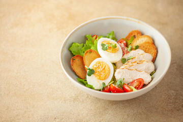 Delicious caesar salad with parmesan cheese and homemade croutons. Copy space