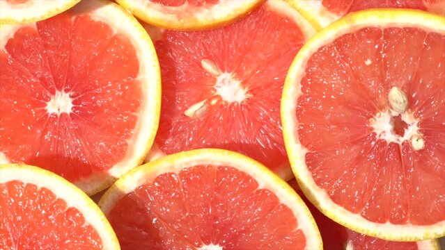 Grapefruit slices in 360 degree motion. 