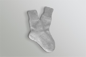 Set of soft socks on gray background