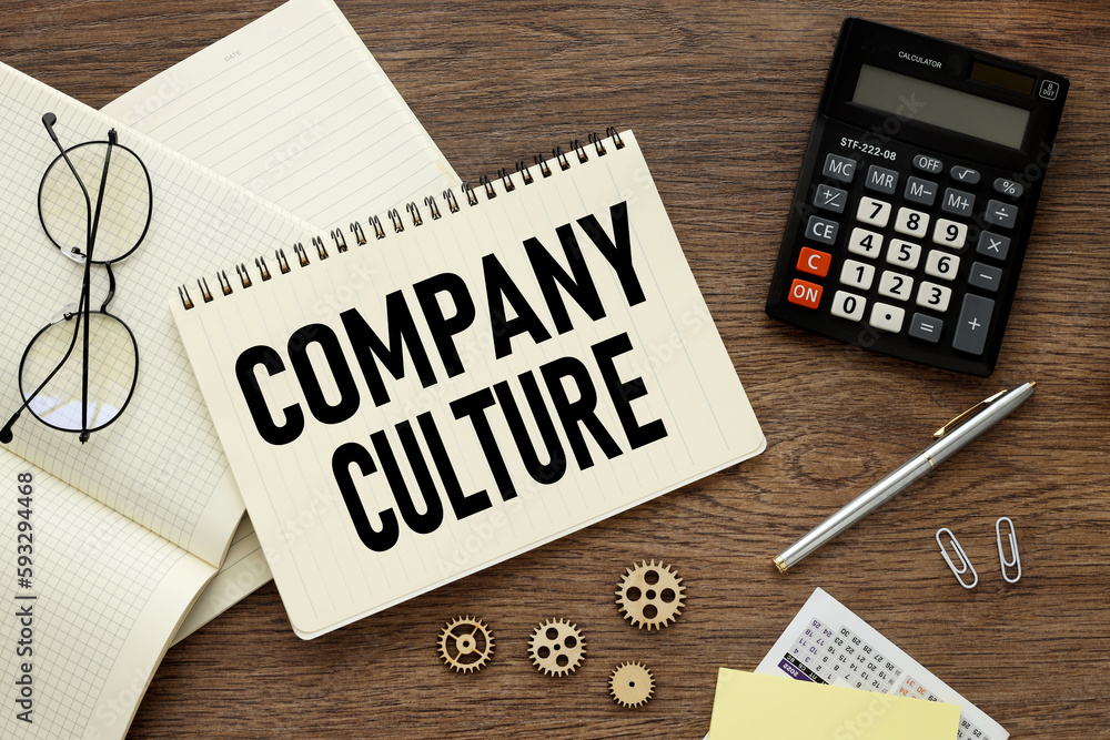 Poster company culture concept on blackboard. open notepad with text on notebook on work table