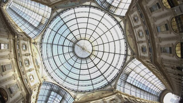 Glass Dome in Vittorio Emanuele II Gallery. Spinning camera upward shot in Luxury shopping mall in Milano.
