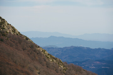 Beautiful landscape from the top of the mountain with blue sky. Views of the Valles Oriental from the Montseny mountain, Catalonia, Spain.  
