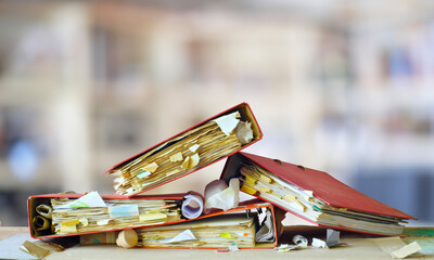 heap of messy file folders, red tape, bureaucracy, chaos, business concept, free copy space