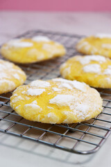 delicious lemon cracked cookies with sugar powder on baking rack 