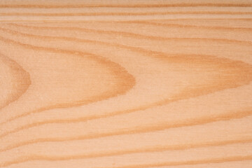 Wooden background from processed wood planks close-up.