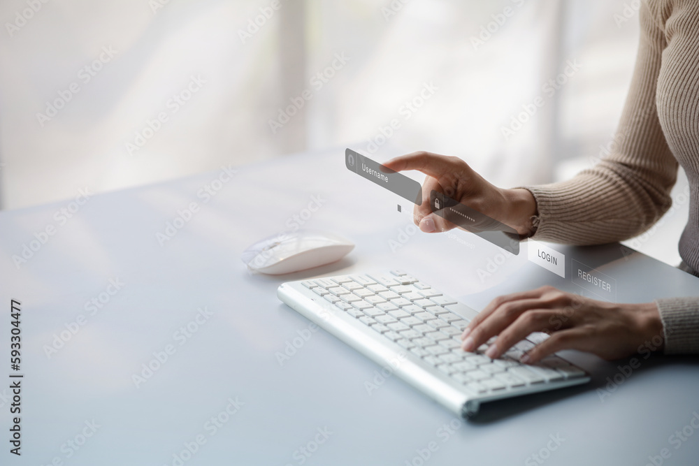 Poster an individual is typing on a laptop keyboard showing a hologram interface to a member login, a busin