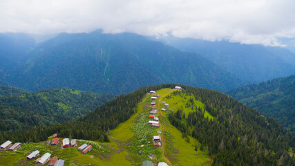 Naklejka na ściany i meble POKUT PLATEAU aerial view with foggy weather. This plateau located in Camlihemsin district of Rize province. Kackar Mountains region. Rize, Turkey. Drone shot.