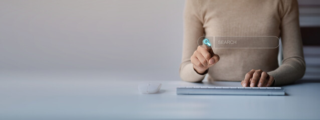 The user is typing a keyboard with a hologram search box. Searching information on the Internet,...