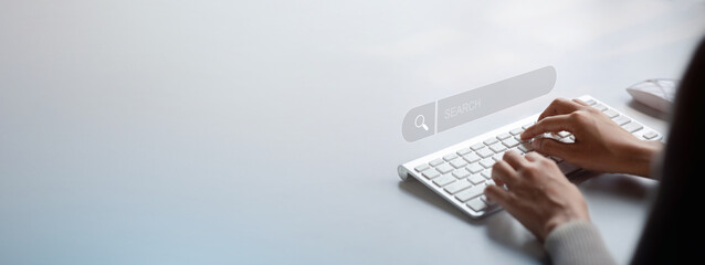 The user is typing a keyboard with a hologram search box. Searching information on the Internet,...