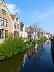 Fototapeta na wymiar Bruges, April 2023: Magnificent facades of the buildings of Bruges, the Venice of the North