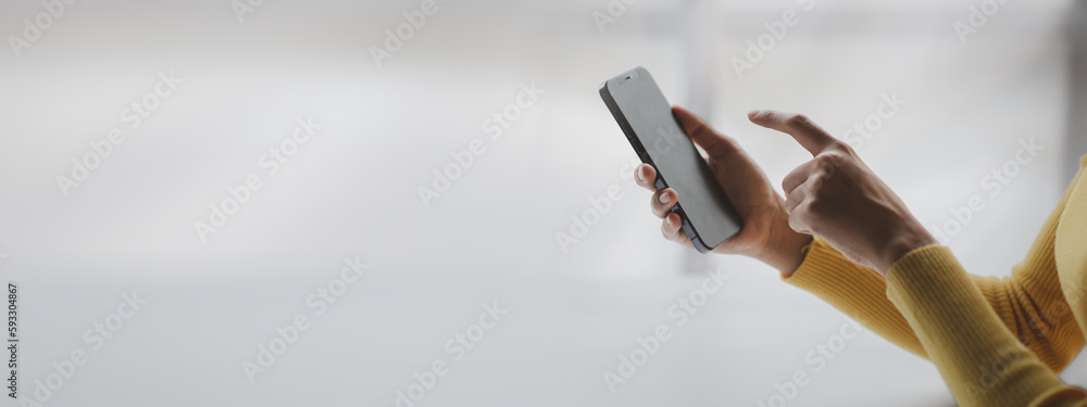 Poster a person holds a mobile phone to use social media on a smartphone, communicating via the internet on