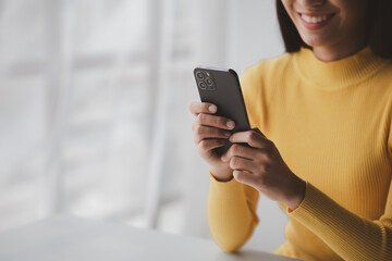 A person holds a mobile phone to use social media on a smartphone, communicating via the Internet on a smartphone. The concept of using technology in communication.