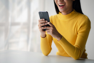 A person holds a mobile phone to use social media on a smartphone, communicating via the Internet on a smartphone. The concept of using technology in communication.