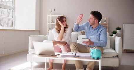 Couple Doing Taxes And Family Budget