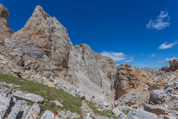 Path in the middle of dolomite rocky scenario in the Latemar Massif, UNESCO world heritage site. Trentino-Alto Adige, Italy, Europe