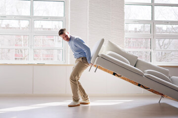Men Carrying Furniture. Moving Sofa