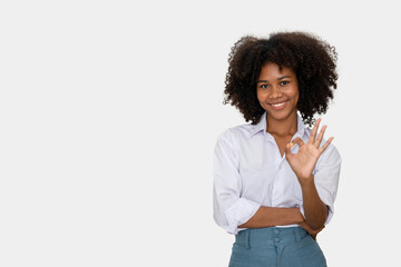 black woman making hand sign OK isolated on white background, signs and symbols, body language