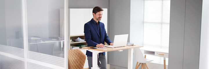 Adjustable Height Desk Stand In Office