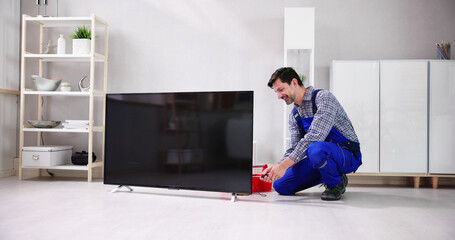 Fototapeta na wymiar Electrician Repairing Television Or TV Appliance