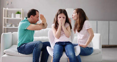 Parent Sitting On Sofa Quarreling Loudly