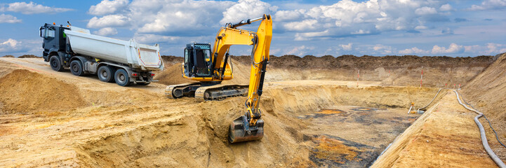 excavator is digging and working at construction site
