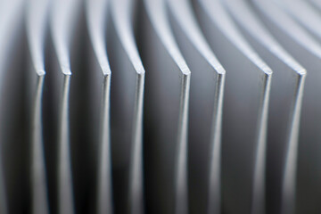 Computer processor heatsink and electronics, metal part. Macro photography, closeup with blurred background.