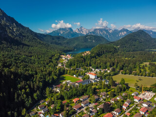Fototapeta na wymiar Aerial view castle in Neuschwanstein Fussen, Bavaria, Bayern. Germany by drone. Alps mountains.