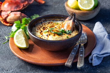  CHILEAN FOOD.  Baked crabmeat crab meat with cheese, cream and bread.  Traditional dish of chilean...