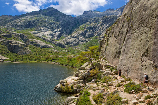 Hiking trail at the beautiful mountain Melu lake, Lac de Melo, in Restonica valley in Corsica